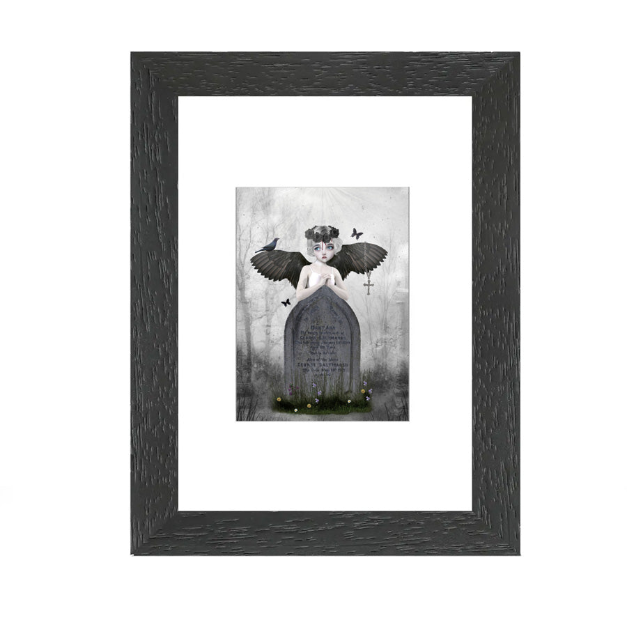 Artist Trading Card showcases a melancholic fallen angel, symbolizing loss and longing. Capturing the mood of the figure as she leans on a grave in a cemetery,