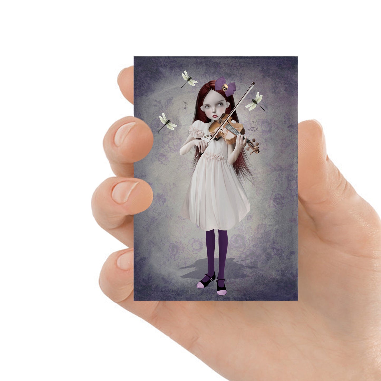 ACEO art card featuring a girl playing violin surrounded by dragonflies, held in hand—surreal art style with whimsical elements.