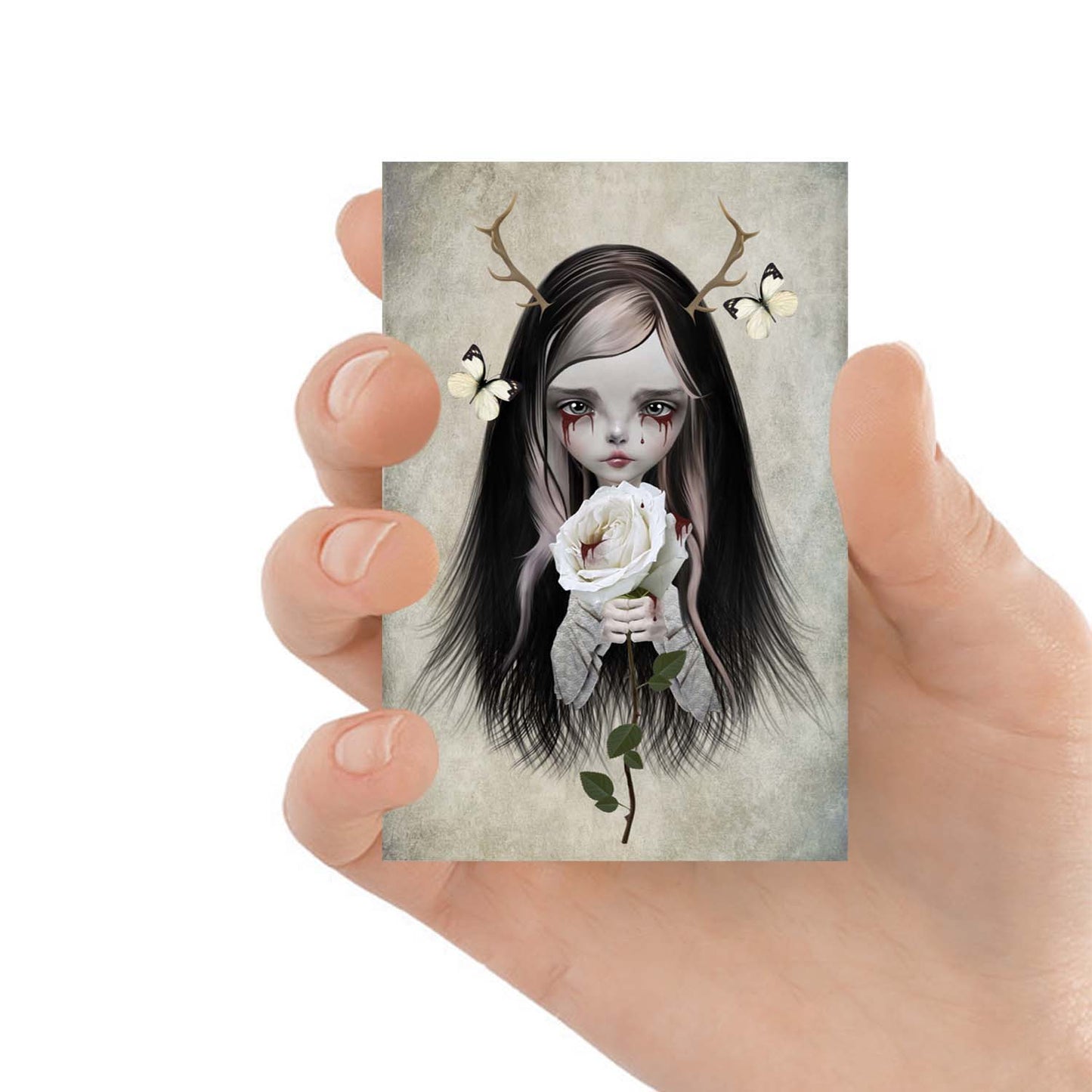 Rose Red adorns antlers and bleeding eyes, clutching a white rose. Witness the crimson tears that have stained this delicate flower.