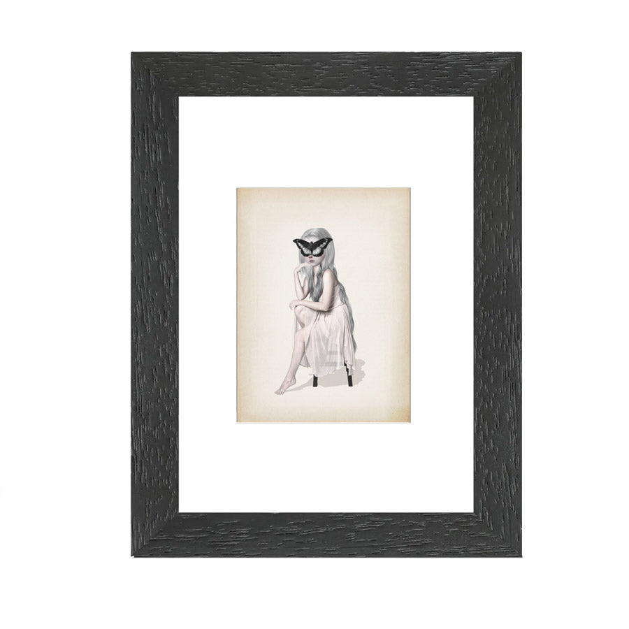 Framed ACEO Artist Trading Card. Featuring a girl sitting with an oversized butterfly covering her face,