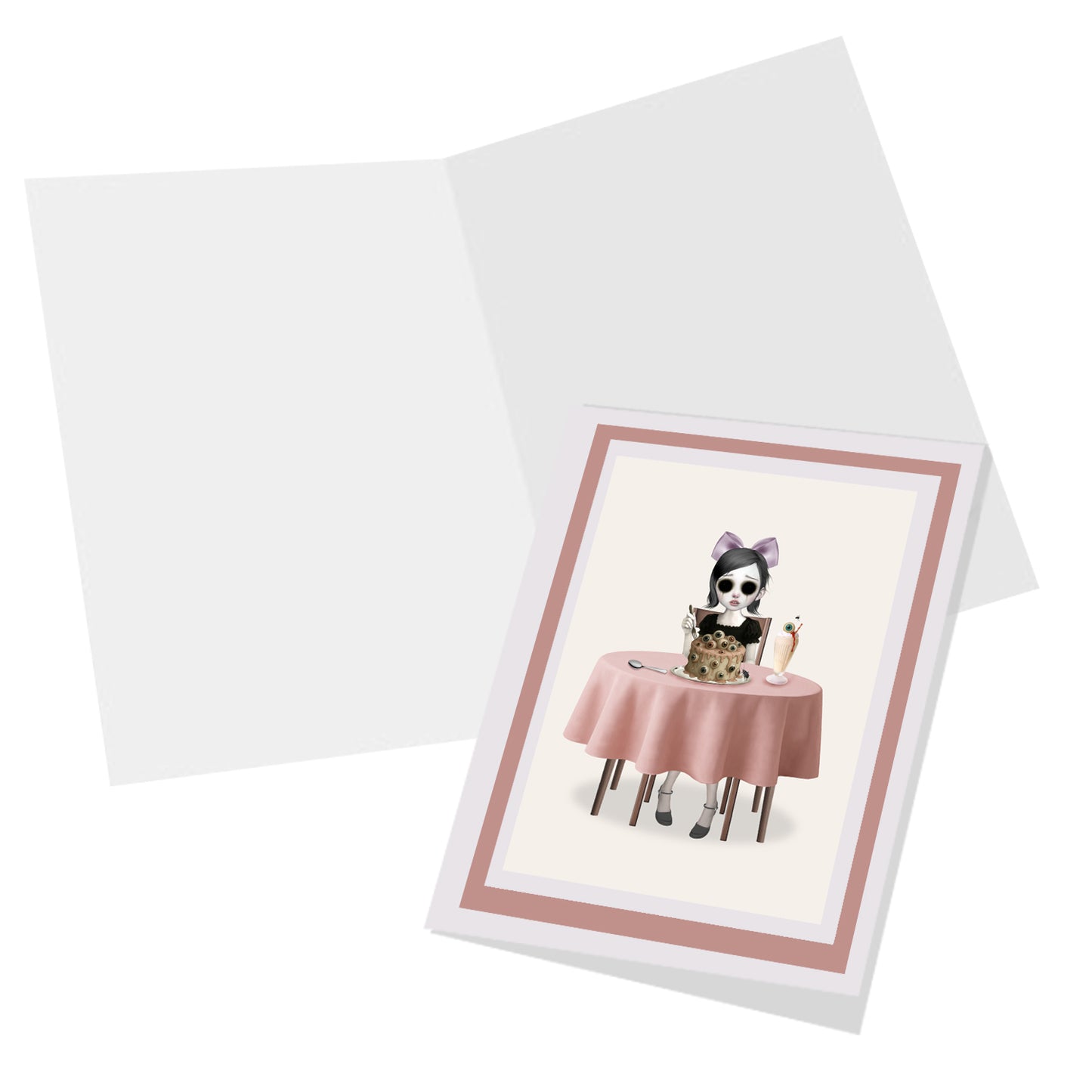 Inside of greeting card shown blank – surreal eyeball cake design.