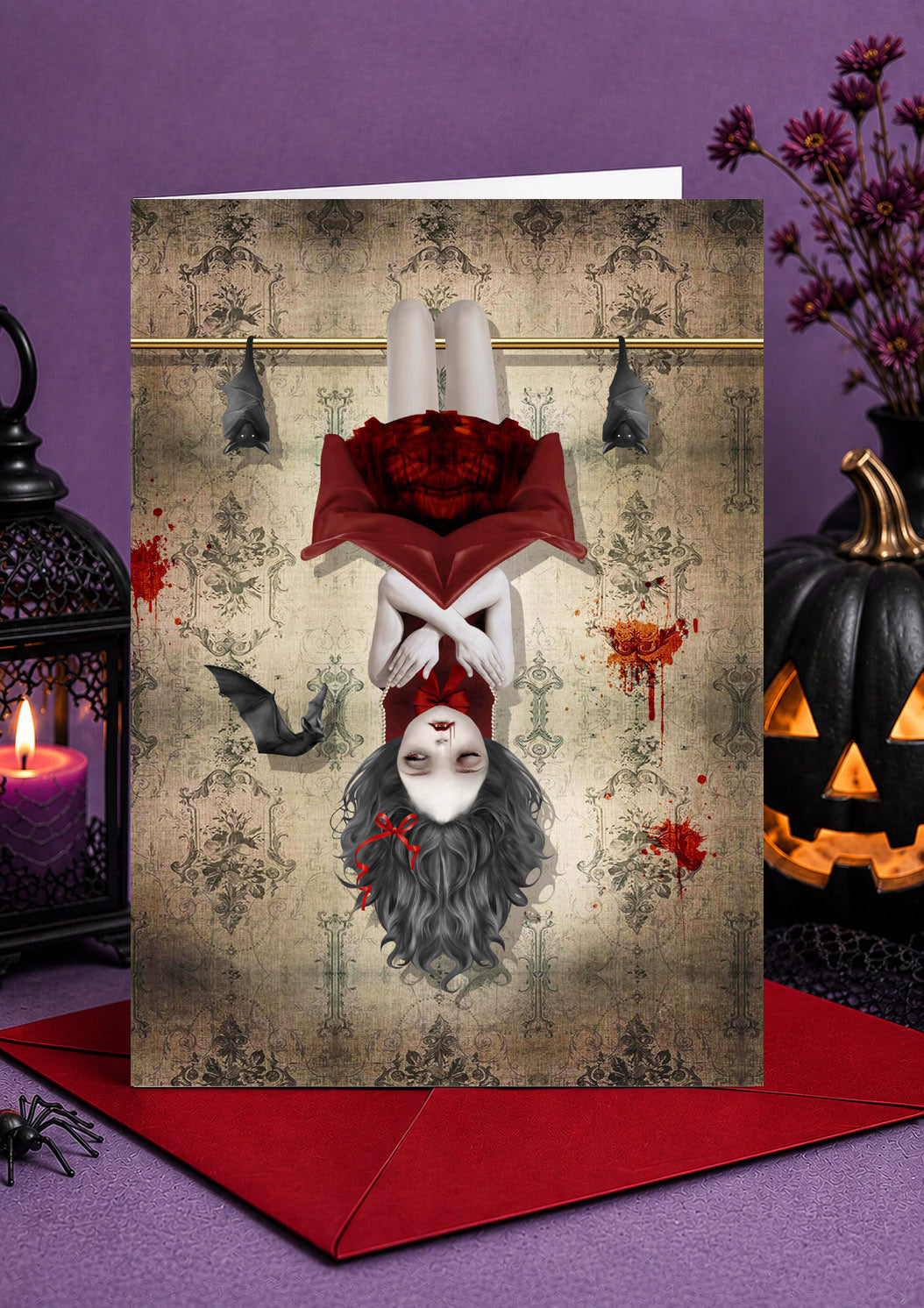 Illustration of a vampire girl in a red cape hanging upside down alongside bats on vintage ornate wallpaper.