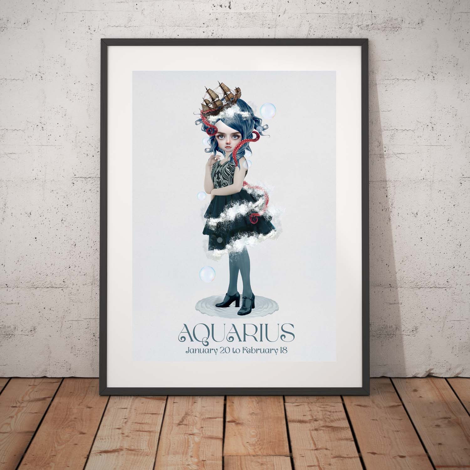 Aquarius girl art print in a black frame, standing against a white wall.
