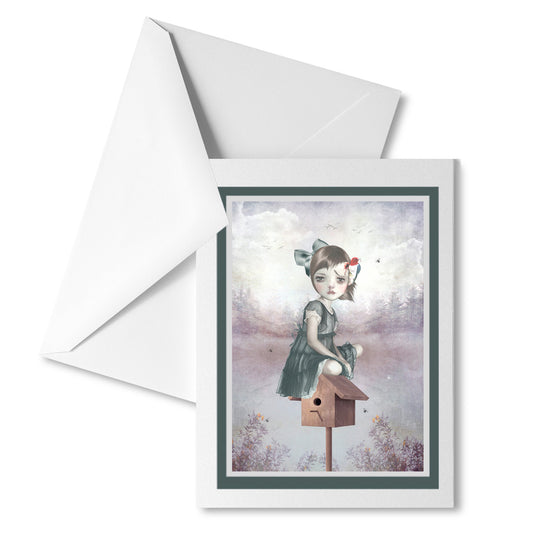 Art greeting card featuring a girl and woodpecker, accompanied by a white envelope .
