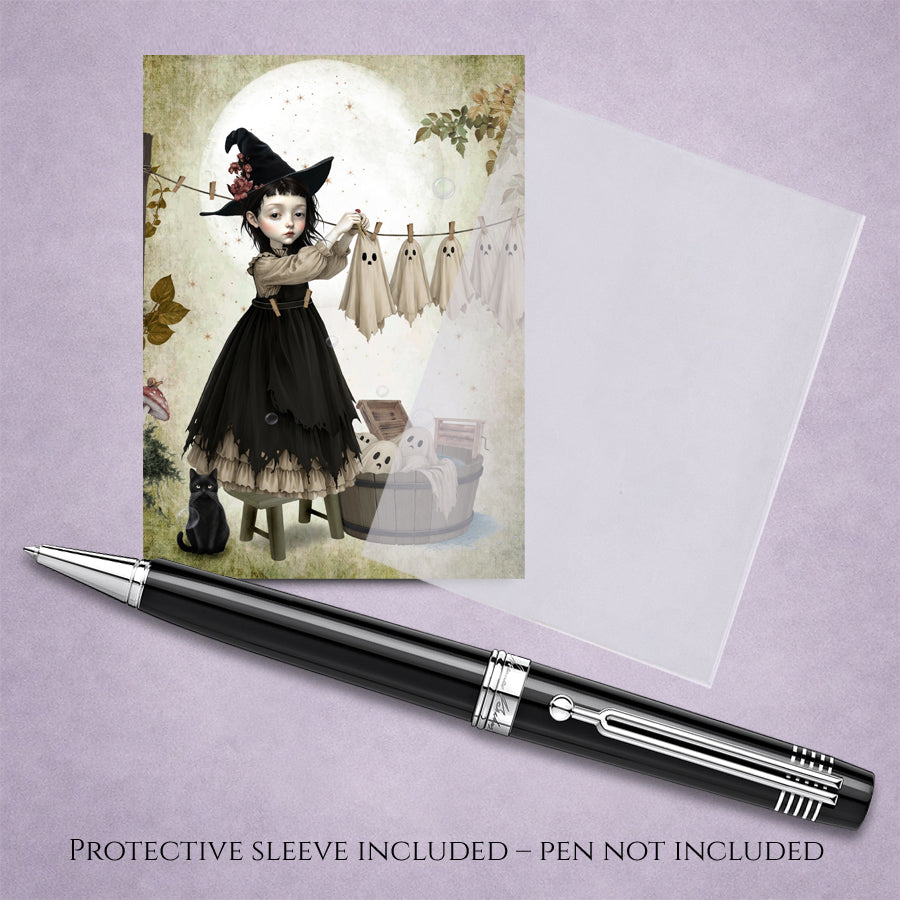 Miniature 2.5x3.5 ACEO art trading card and protective sleeve of a gothic witch girl hanging sheet ghosts on a clothesline