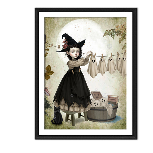 Dark cottagecore autumn art print in A4 Frame. A gothic witch girl in a black hat hanging sheet ghosts on a clothesline with a black cat nearby.
