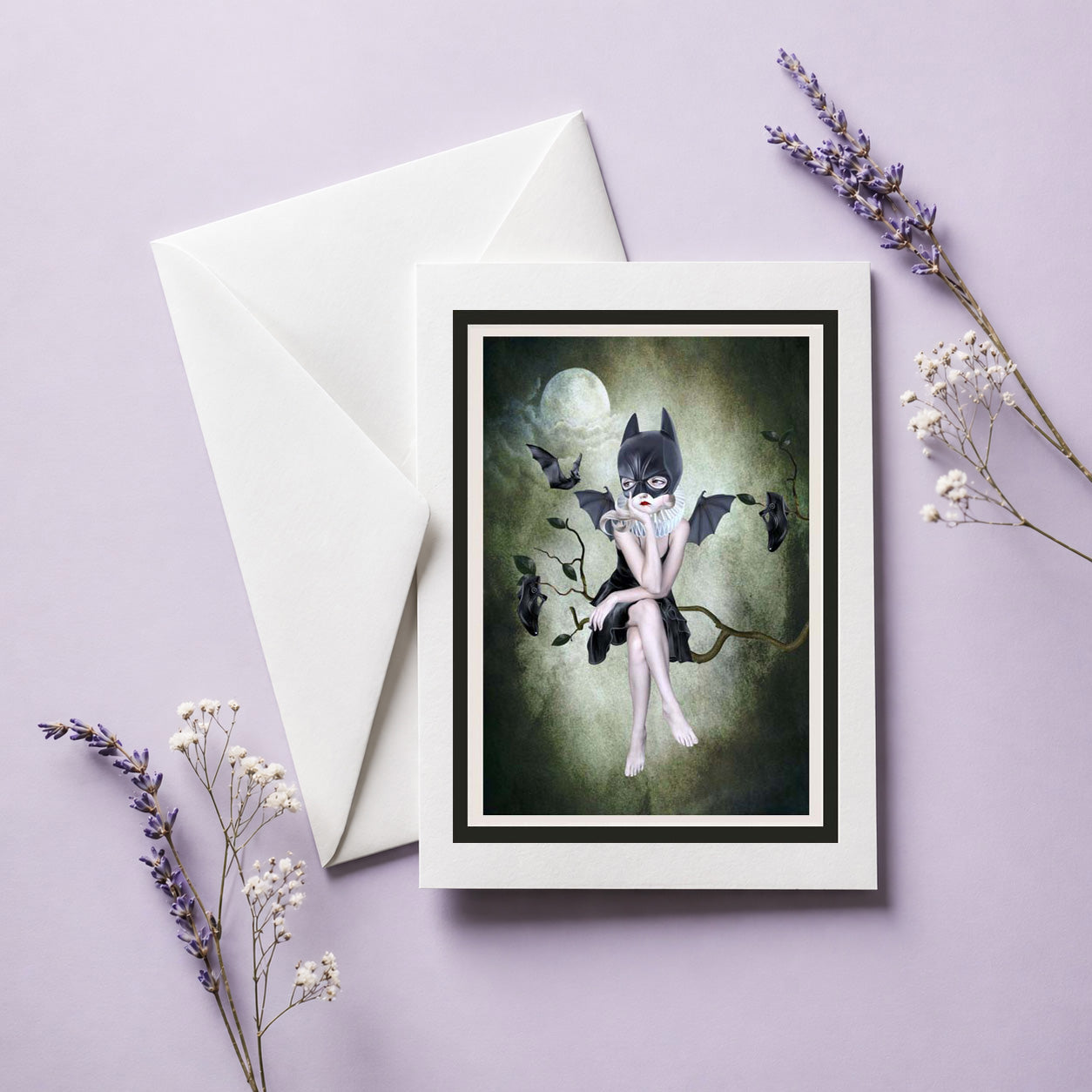 Bat Girl Greeting Card with envelope on lilac background.