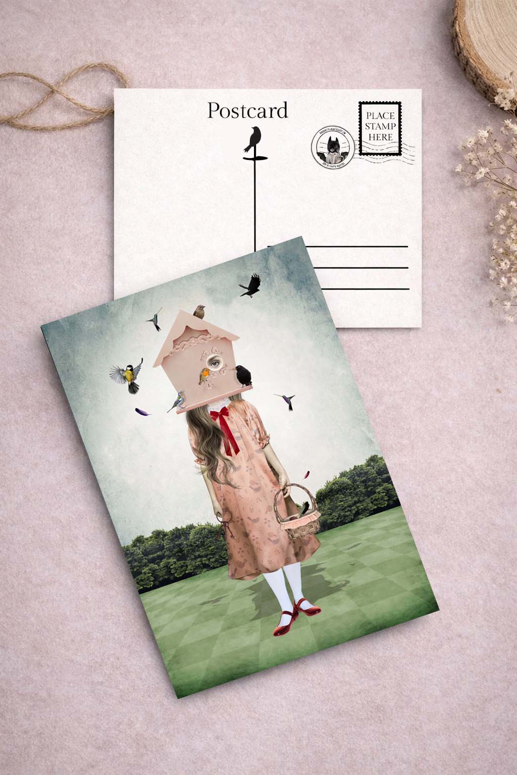 Postcard with a illustration of a girl wearing a birdhouse on her head surrounded by garden birds