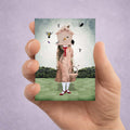 Hand holding a 2.5x3.5 inch Surreal ACEO Art Trading Card featuring a Birdhouse Girl Illustration miniature print.
