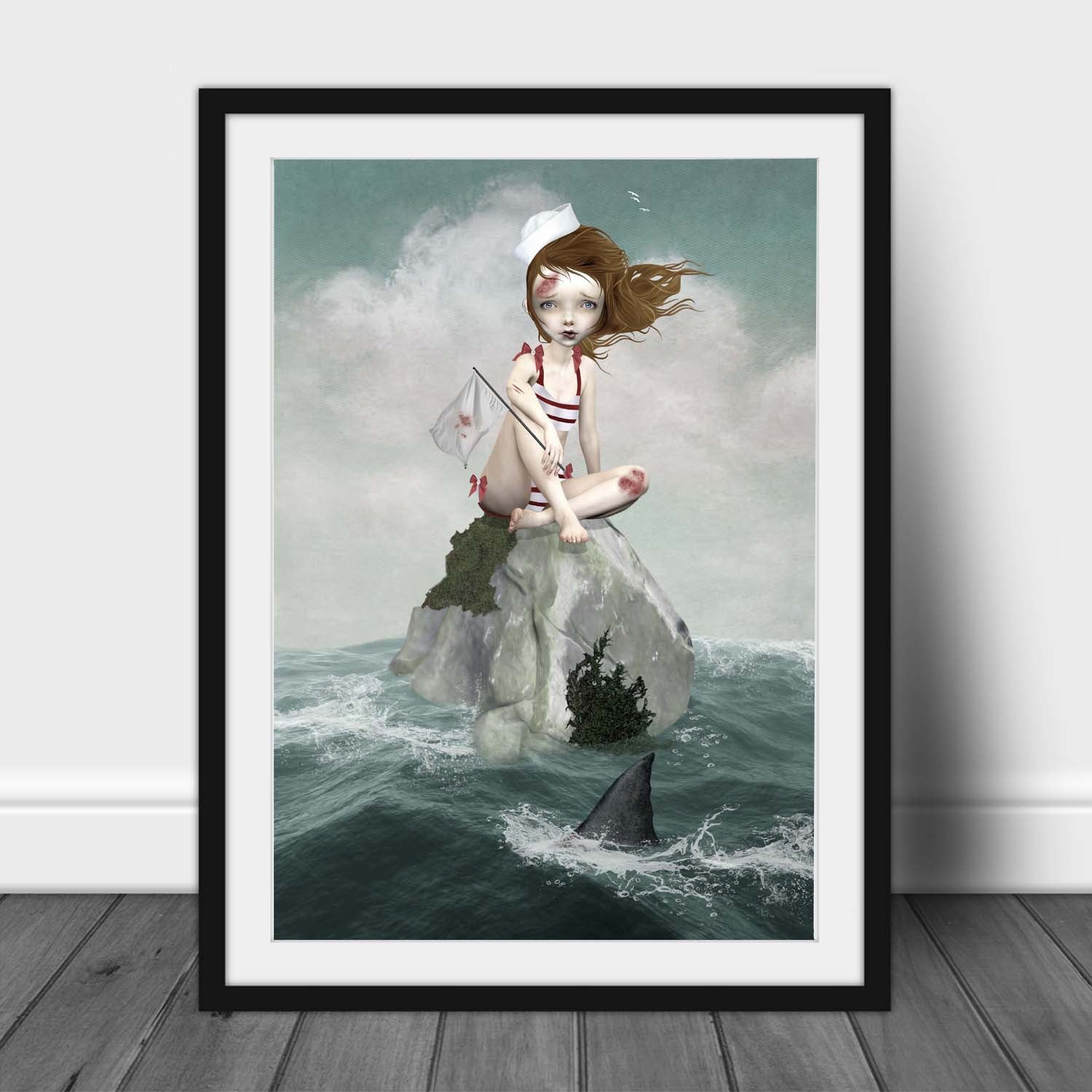 Framed artwork of a sailor girl sitting on a rock stranded in the middle of the ocean with a shark approaching.