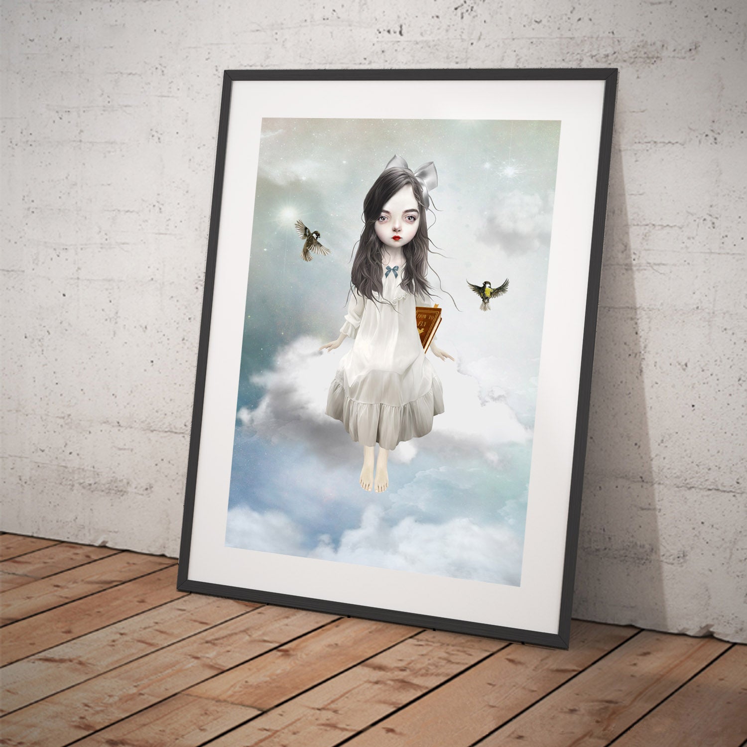 Art print featuring a girl sitting on a cloud. Displayed in a tilted frame for a stylish presentation. Perfect for dreamy -themed decor.