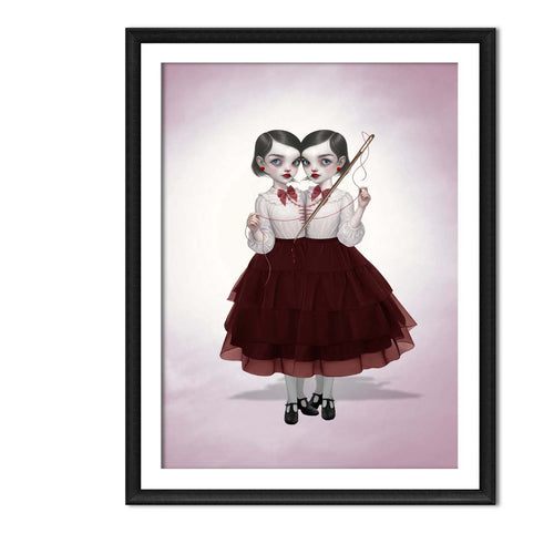 Framed dark pop surrealism art print. This gothic illustration features conjoined twin girls with a needle and thread.
