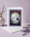 Greeting card with a girl hugging moon design on a purple background with flowers.