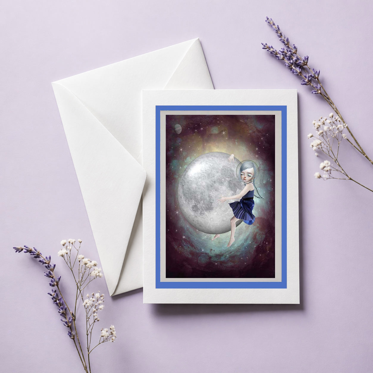 Greeting card with girl hugging moon, envelope, and lavender flowers on a light purple background