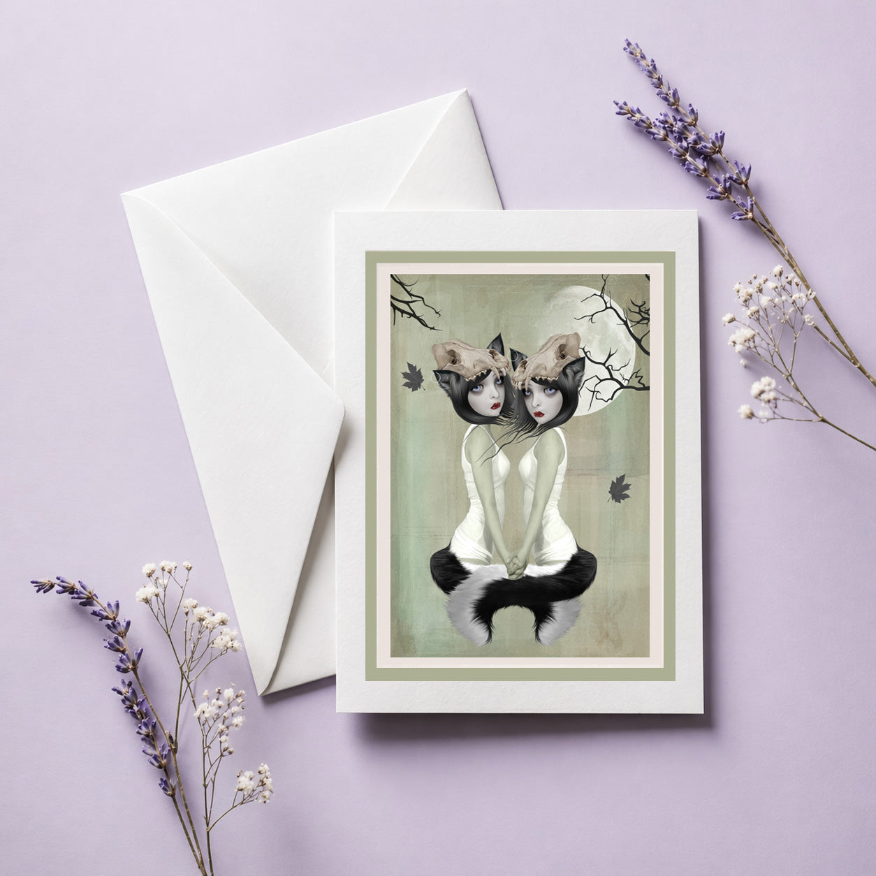 Greeting card with envelope, werewolf illustration displayed on a purple background with flowers.
