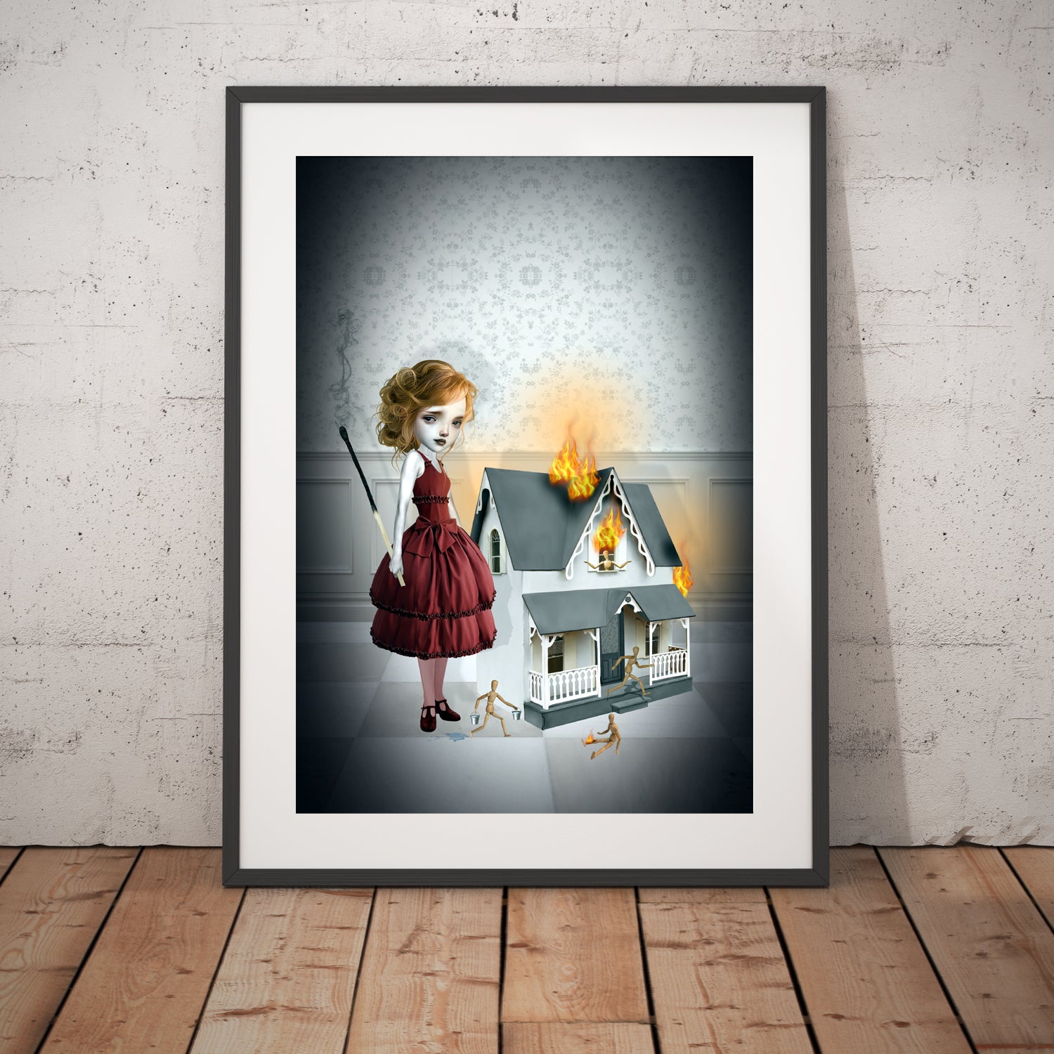 framed for display creepy cute dollhouse wall art, image is a mischevious girl with an oversized matchstick, with a burning dollhouse beside her in flames.