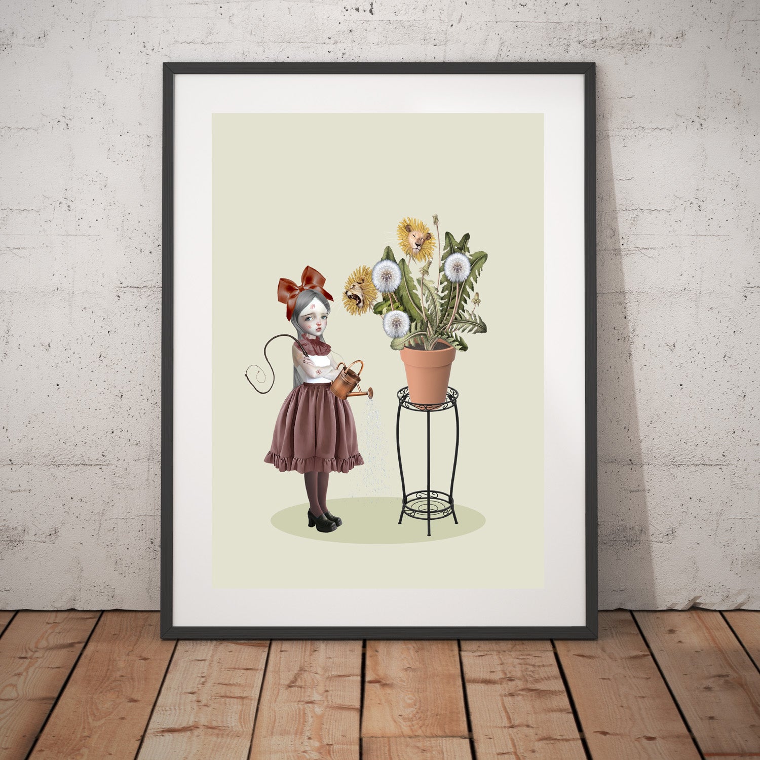 Framed Dandelion wall art print on wall, the image is a girl with scratches and cuts tending to her dandelion plant with real lion heads.