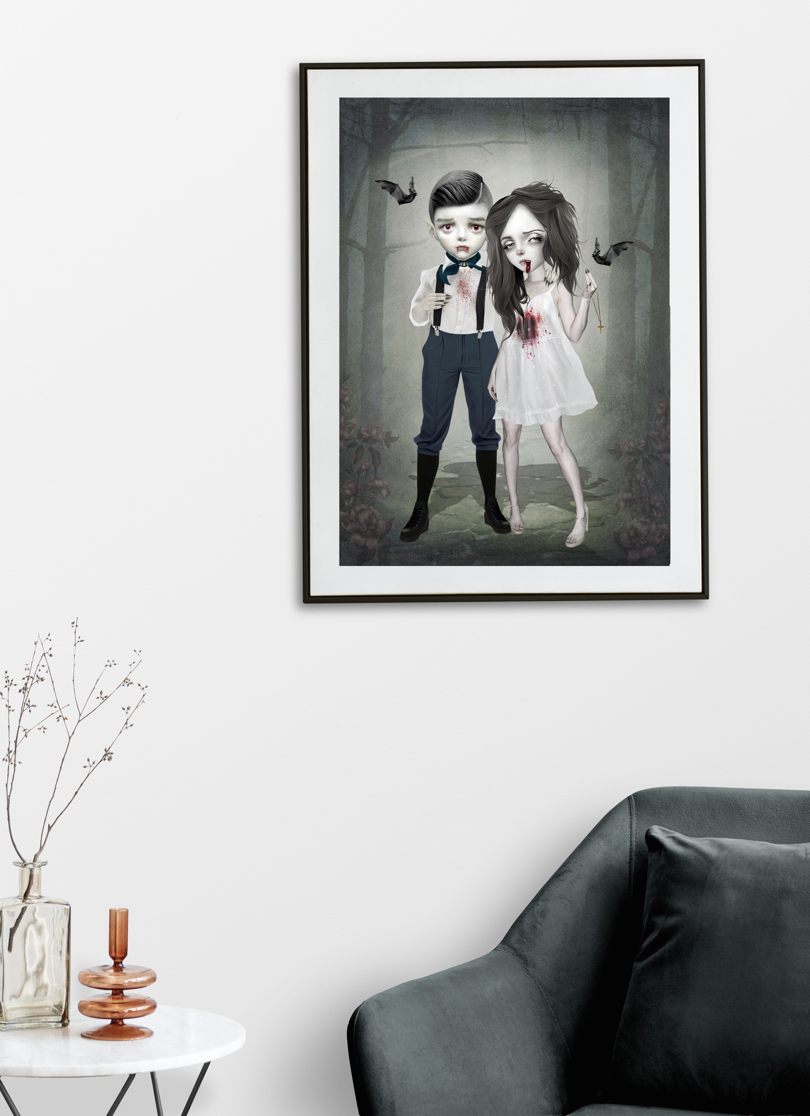 Framed artwork of a vampire couple, hanging on a modern living room wall.