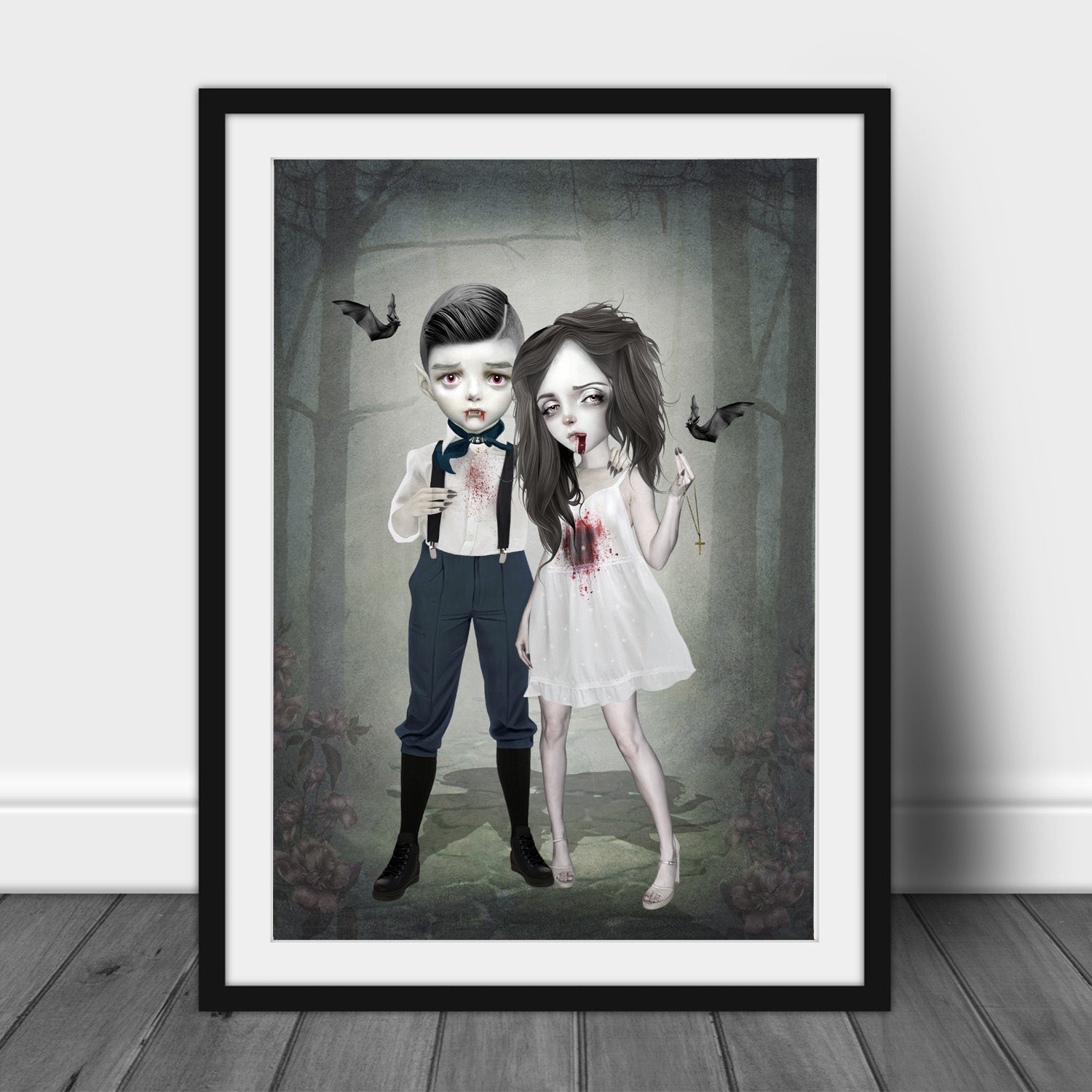 Framed artwork of a vampire boy and girl in a dark forest setting with a black frame.