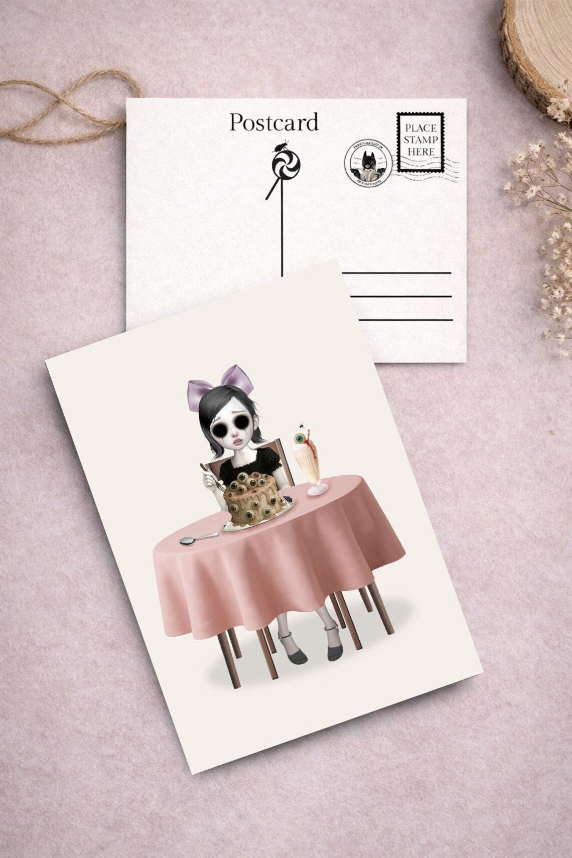Eyeless girl and eyeball cake art postcard from Creepy Cute Sweet Treats Postcard Set.