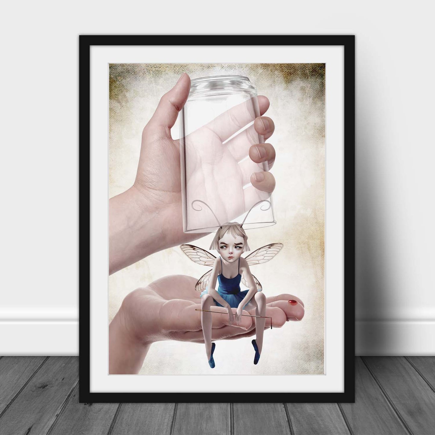 Framed fairy art print leaning against a wall, featuring a fairy defending herself with a sewing needle in a pop surrealism style.