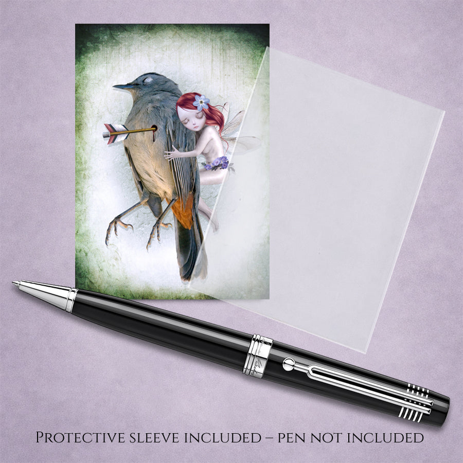 Dark fantasy ACEO art card with a protective sleeve features a whimsical fairy comforting a wounded songbird displayed with a pen.