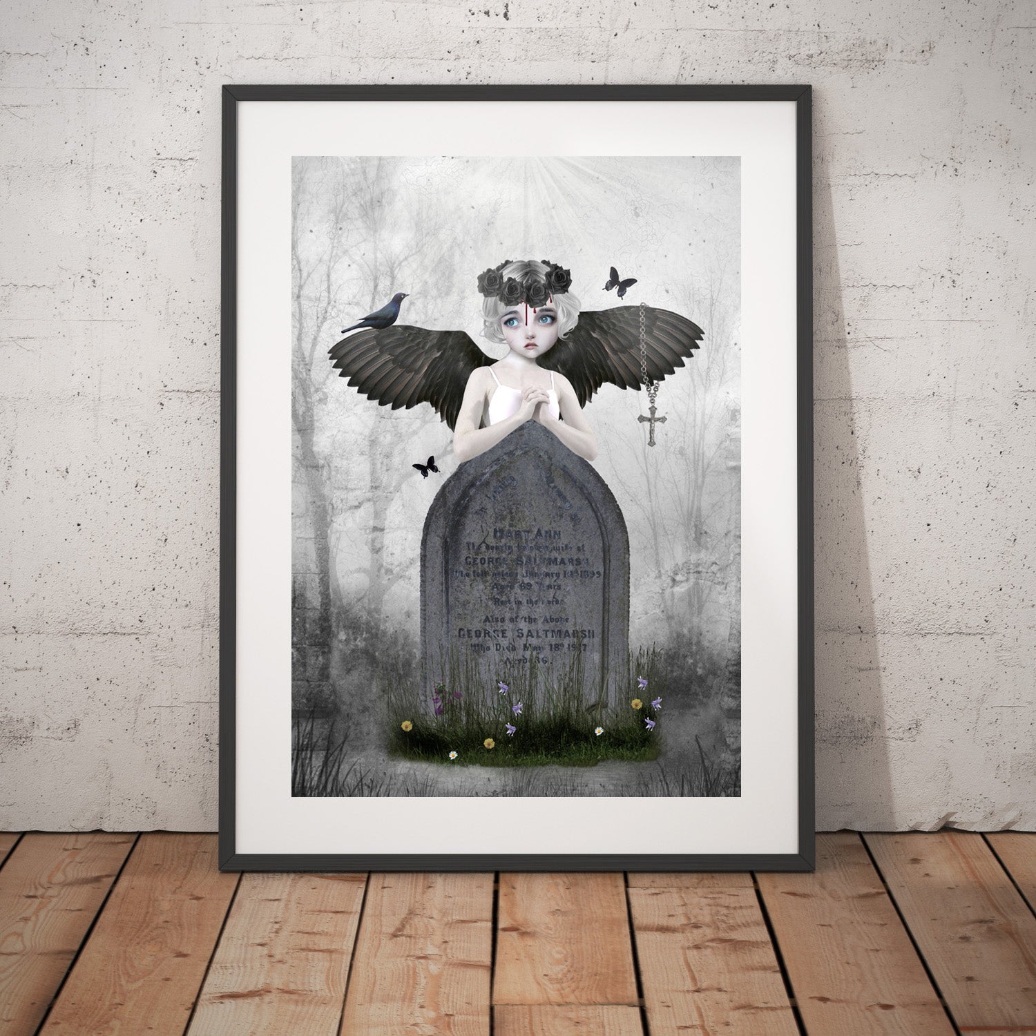 Fantasy art print framed, the image is of a fallen angel resting against an headstone in a cemetery looking sad.