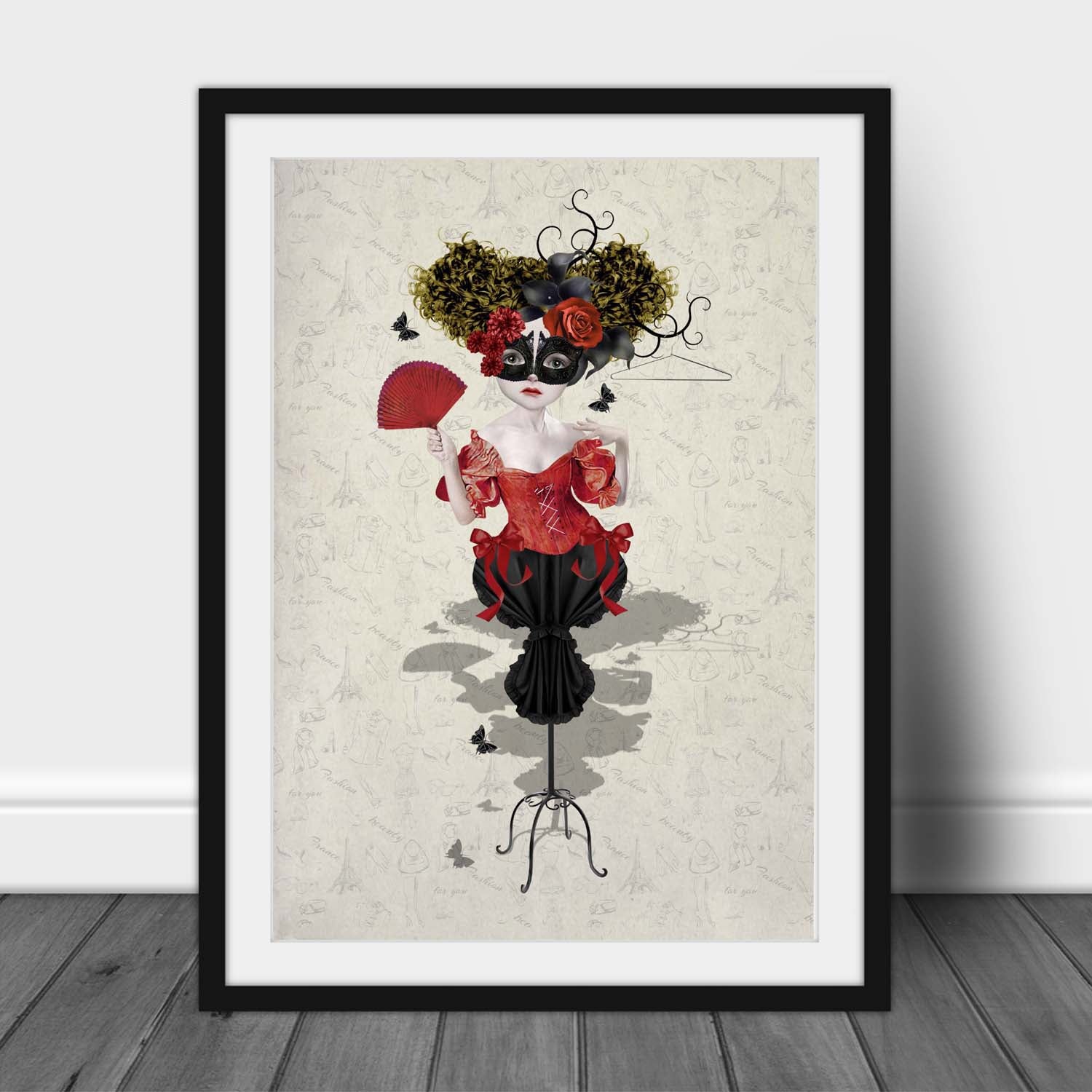 Art print of a Fashion Mannequinl, in a frame, leaned against a wall.