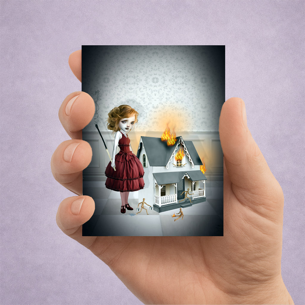 Firestarter ACEO art card. Featuring a surreal girl in a red dress holding a burnt match next to a flaming miniature dollhouse