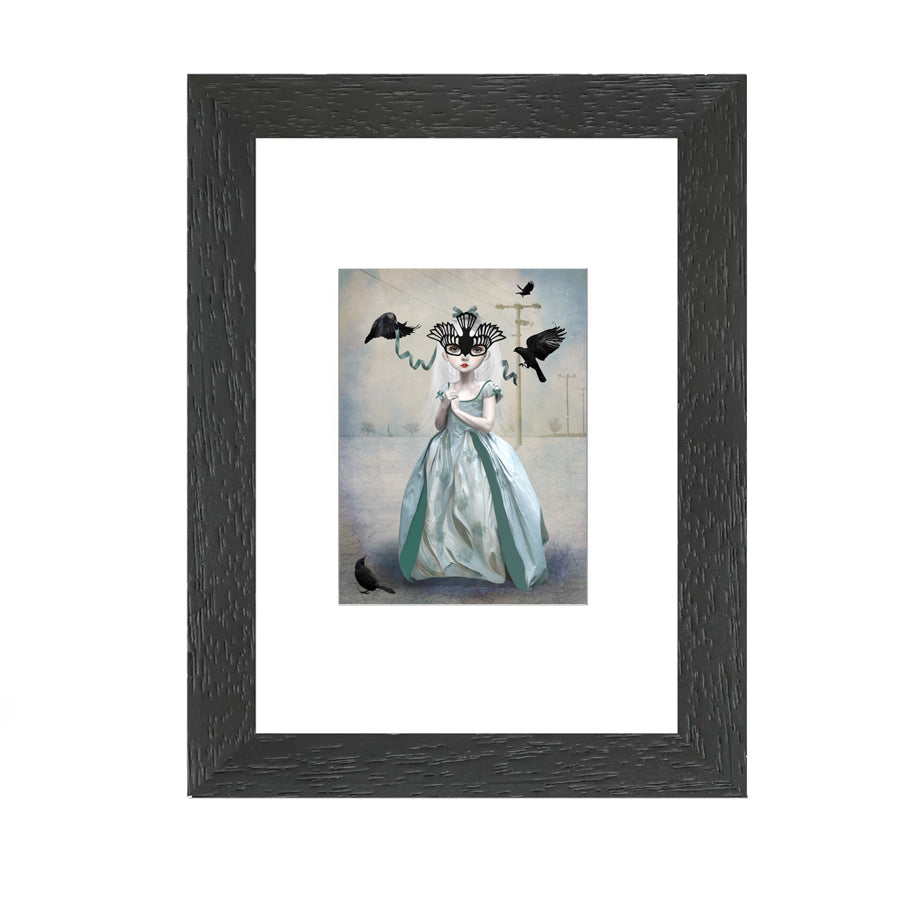 This framed miniature artist trading card features a girl in a blackbird mask, searching for a place to belong.