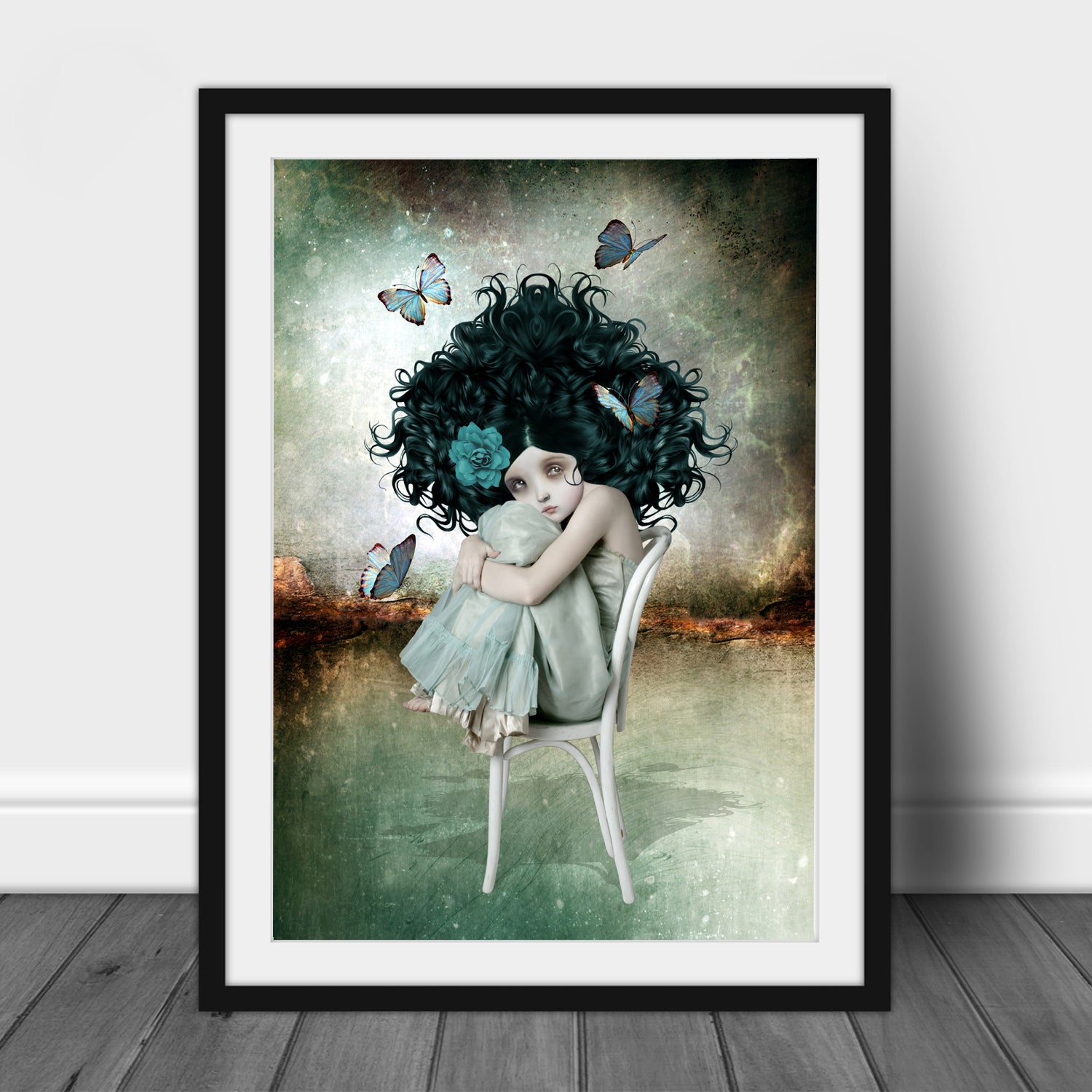 Butterfly art print features a sullen girl with bouffant hair sitting on a chair, surrounded by fluttering butterflies.