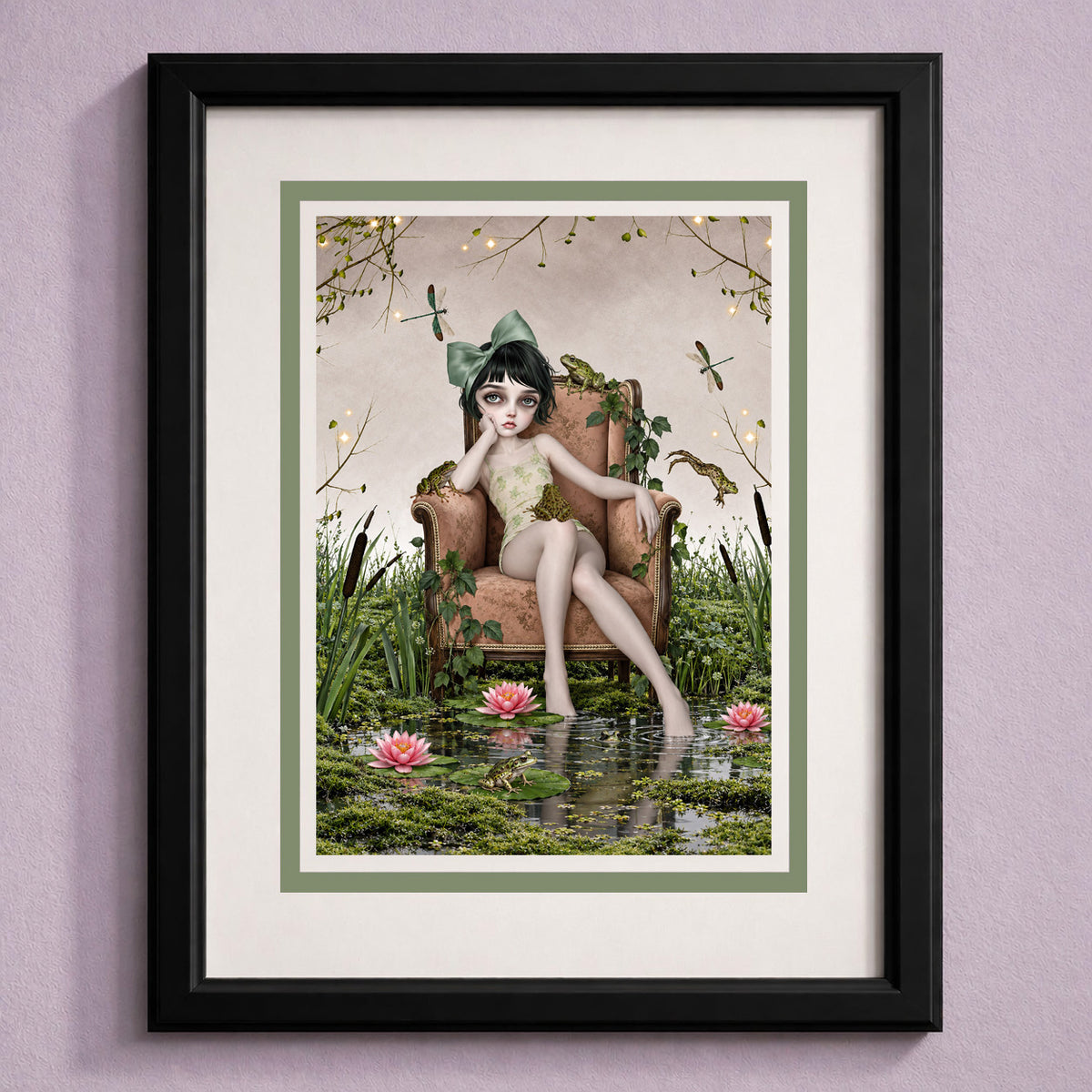 Framed Cottagecore greeting card featuring a girl in an armchair inside a frog pond with water lilies, displayed on a lavender backdrop.