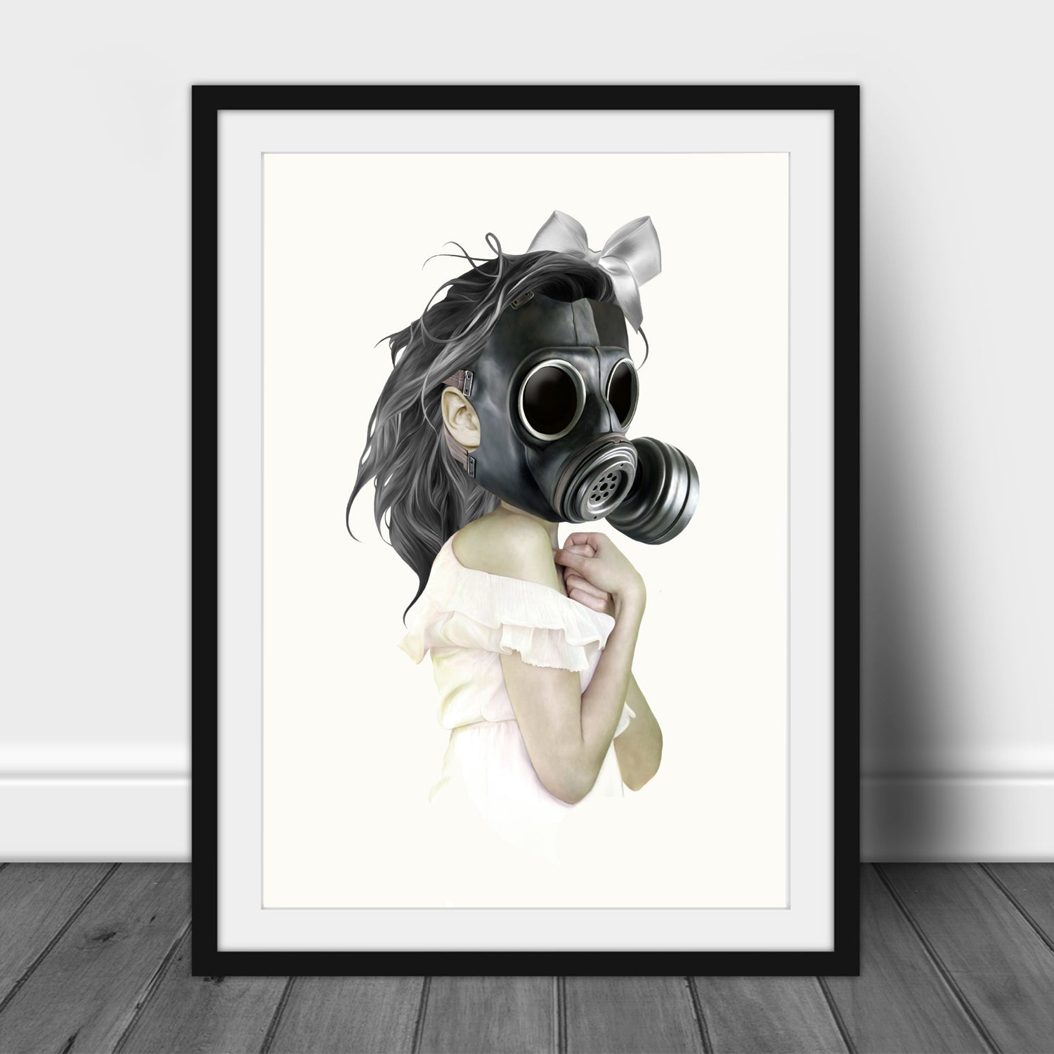 Framed gas mask wall art print features a girl clad in white donning a gas mask.