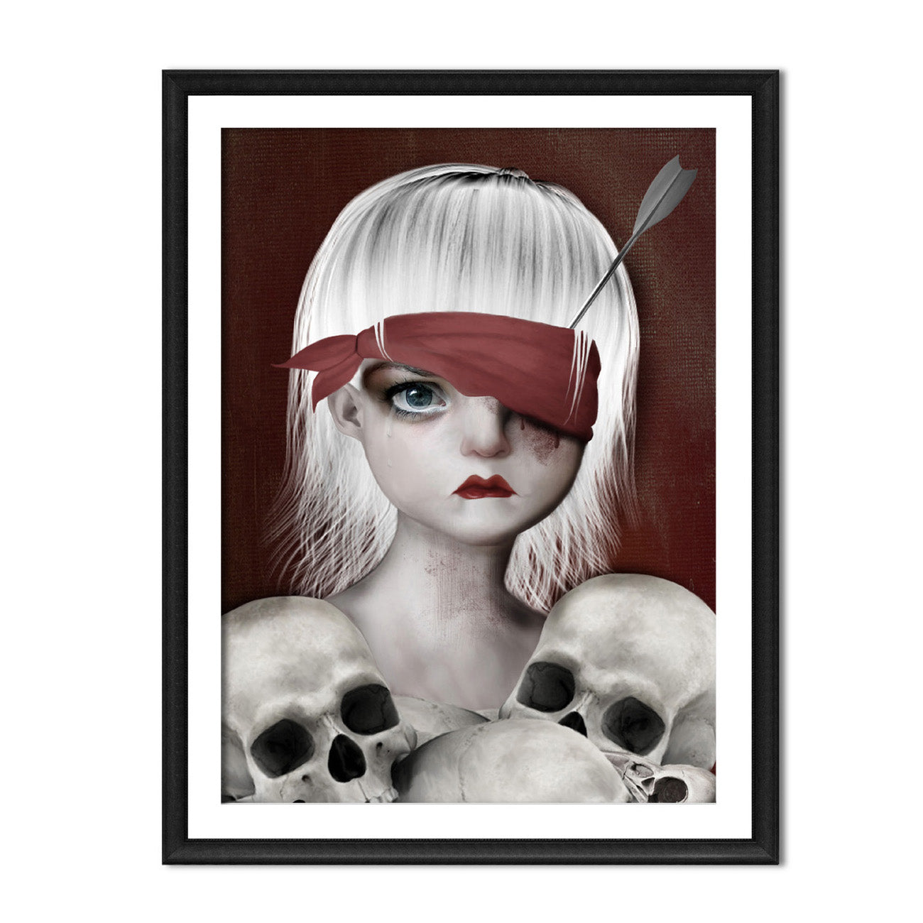 Framed macabre Art Print. Featuring a girl with an arrow in her eye surrounded by human skulls