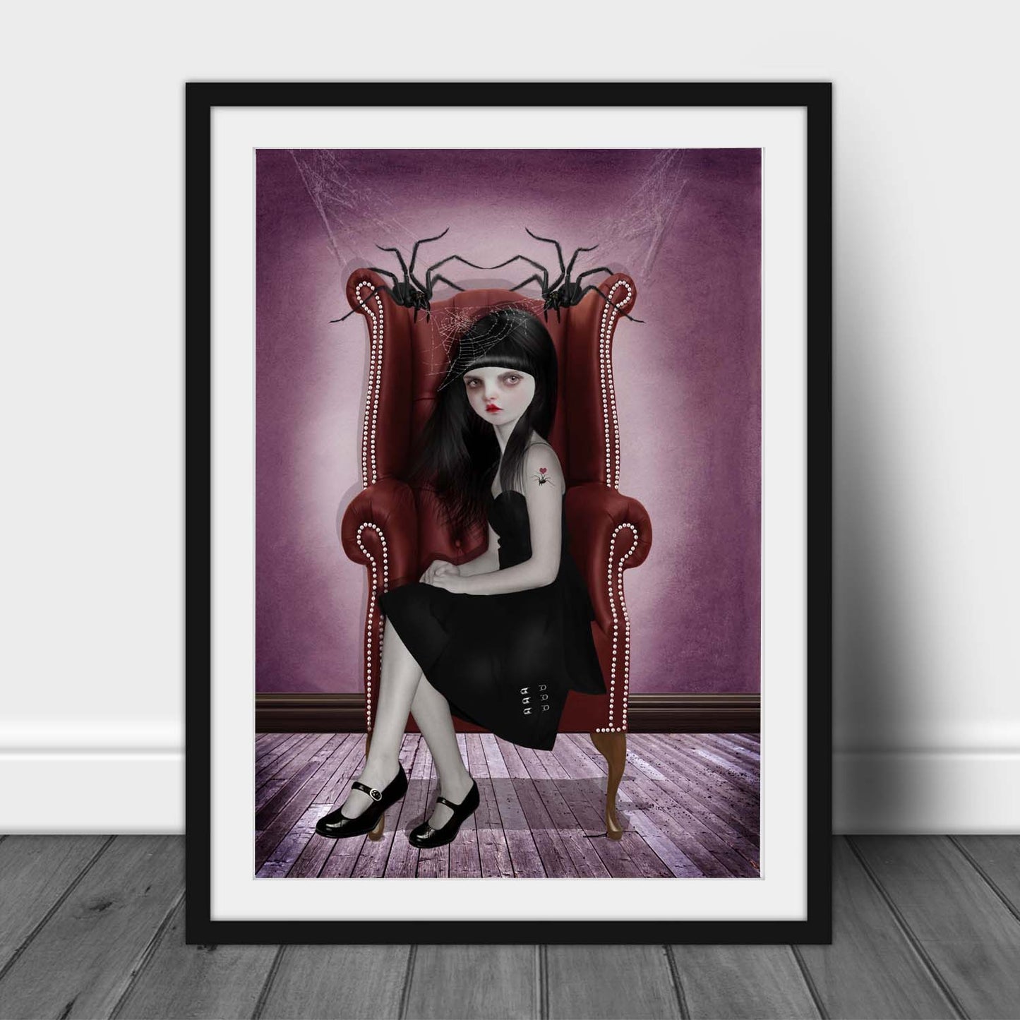 Miss Muffet sitting with her pet spiders in this creepy cute framed art print.