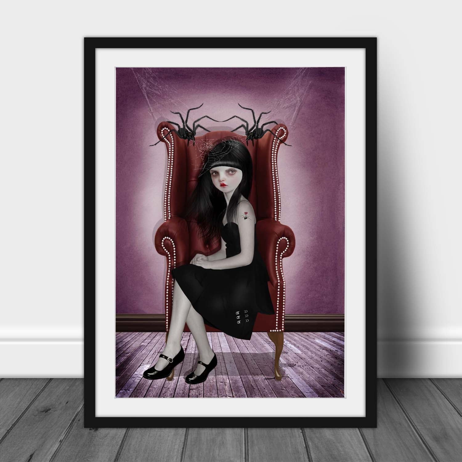 Miss Muffet sitting with her pet spiders in this creepy cute framed art print.