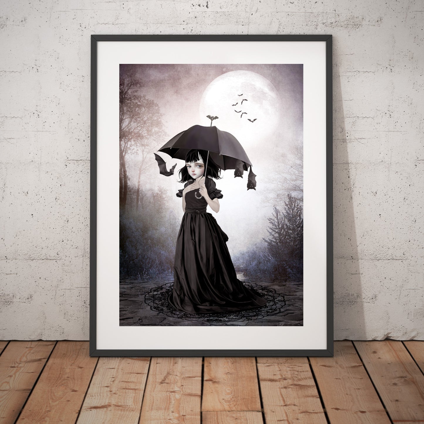 Framed gothic art print, image is a goth girl beneath the moonlight umbrella in hand, bats take slumber hanging from her umbrella.