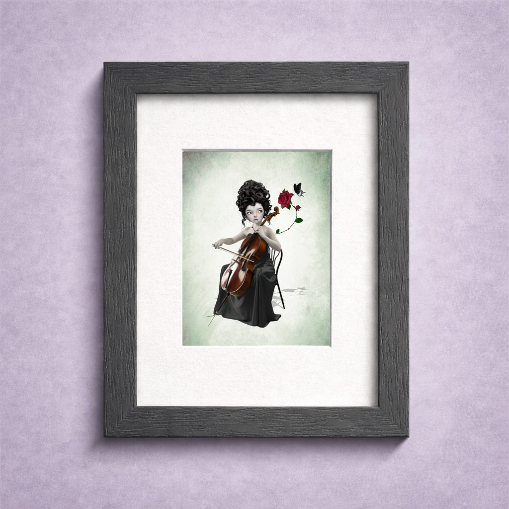 Gothic cello player ACEO art card in a small frame for display. A dark fantasy print featuring a whimsical miniature portrait of a female cellist with a red rose and a black butterfly.
