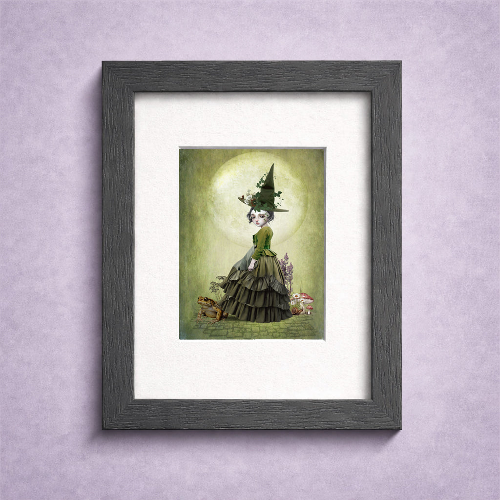 Framed ACEO art print featuring a miniature dark fantasy illustration of a green witchling and giant toad.