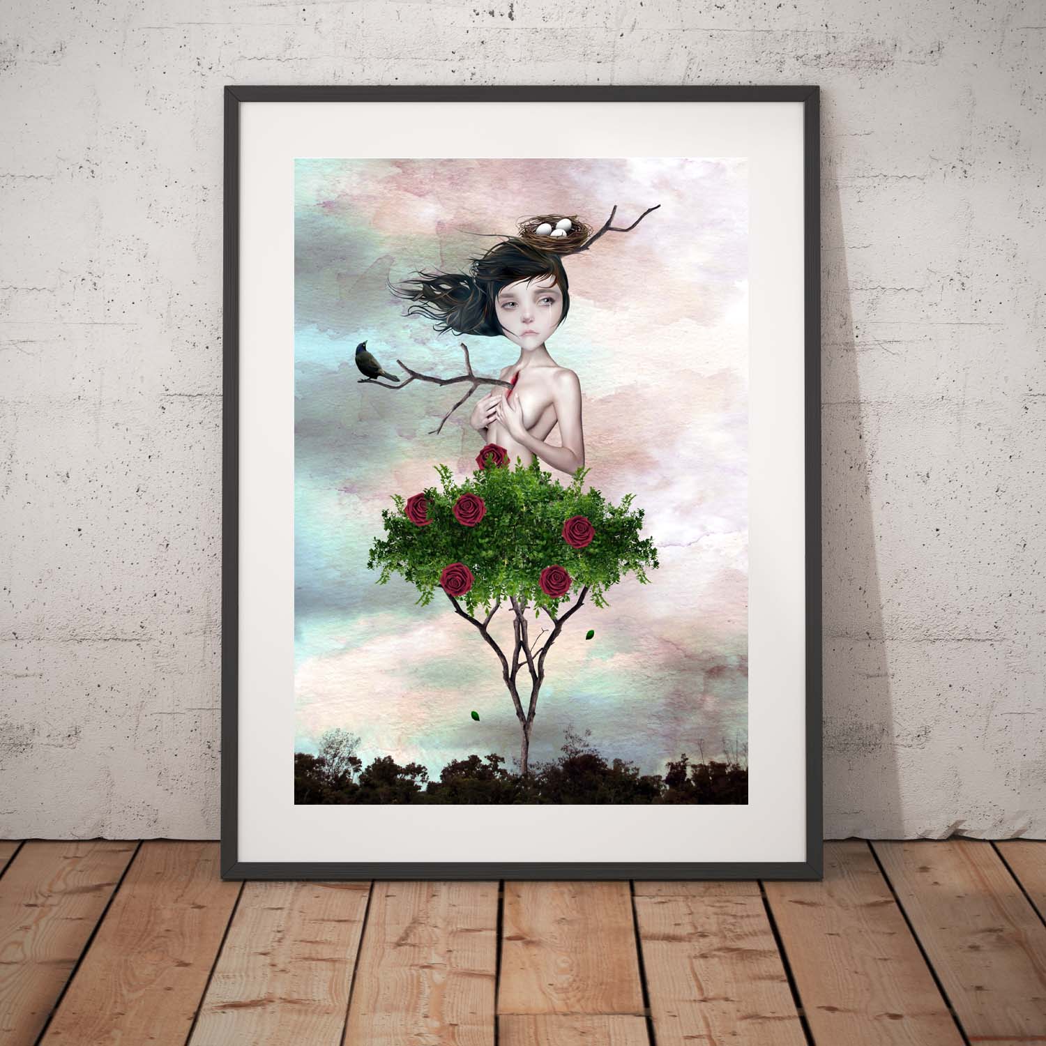 Rose Bush Girl Art Print leaning against a white wall.