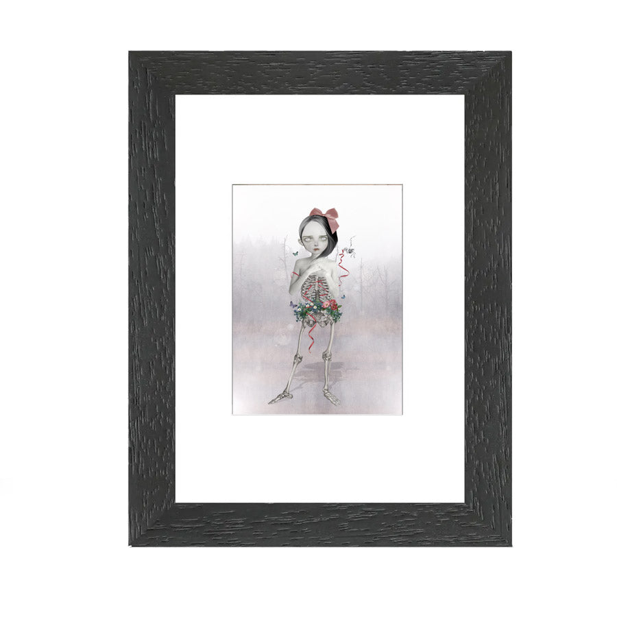 Skeleton Girl ACEO Trading Card. This miniature memento mori collectible art showcases a unique half human half skeletal girl with wild flowers growing around her pelvis.&nbsp;