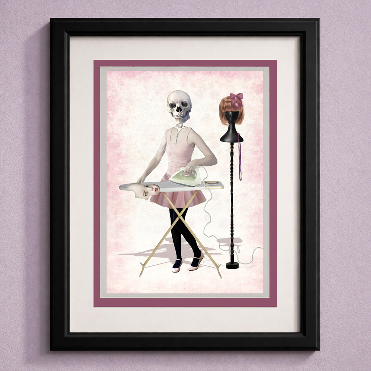 Framed art greeting card of a skeleton ironing clothes on a pink background