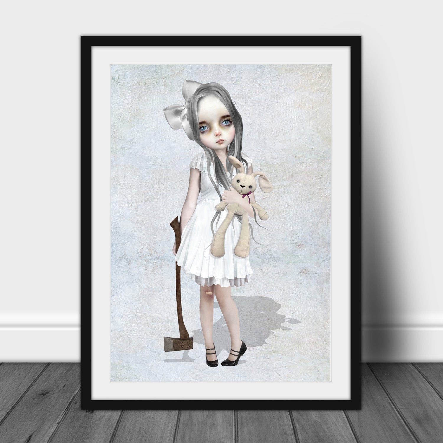 Framed art print of a girl with an axe and toy bunny displayed in a black frame on white background.