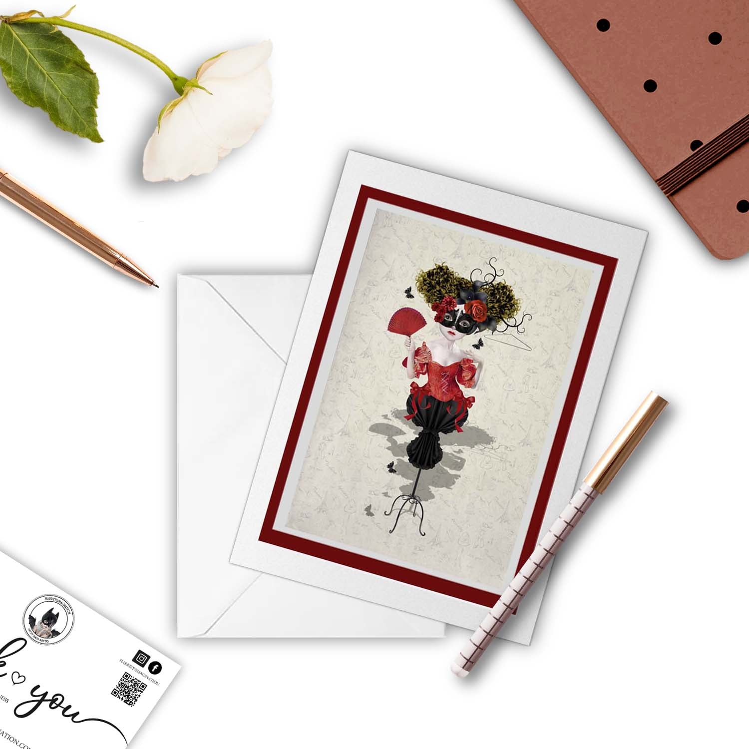 Fashion Mannequin Card Next to Notebook and Pen.