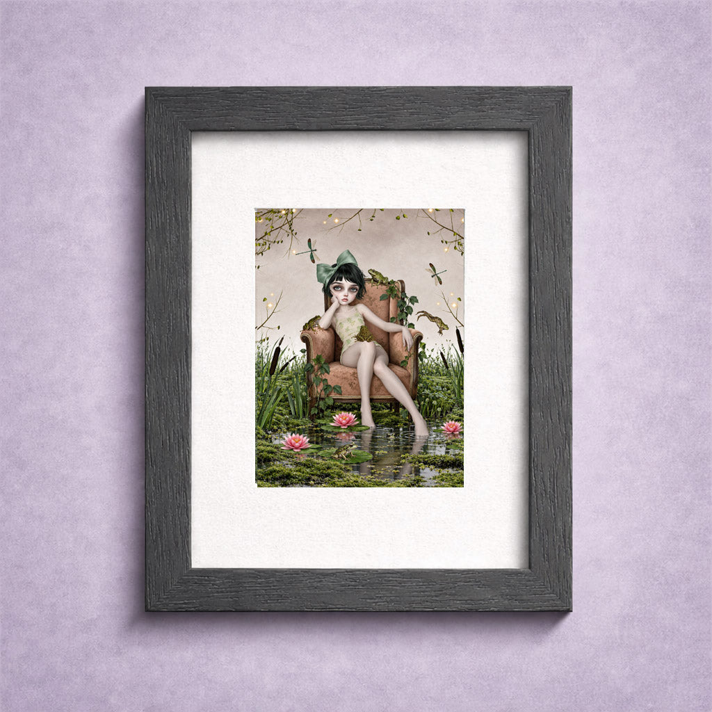 ACEO miniature art card in a small frame featuring a girl in a sage green hair bow sitting in an armchair inside a mossy lily pond with frogs and dragonflies