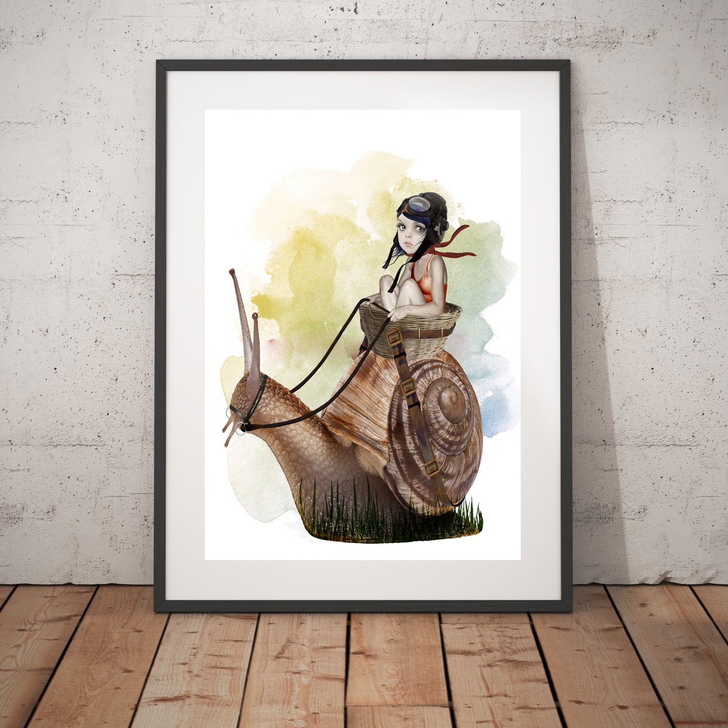 Garden Snail Art Print in a frame. This whimsical wall decor features an oversized garden snail with a playful girl riding on its back.