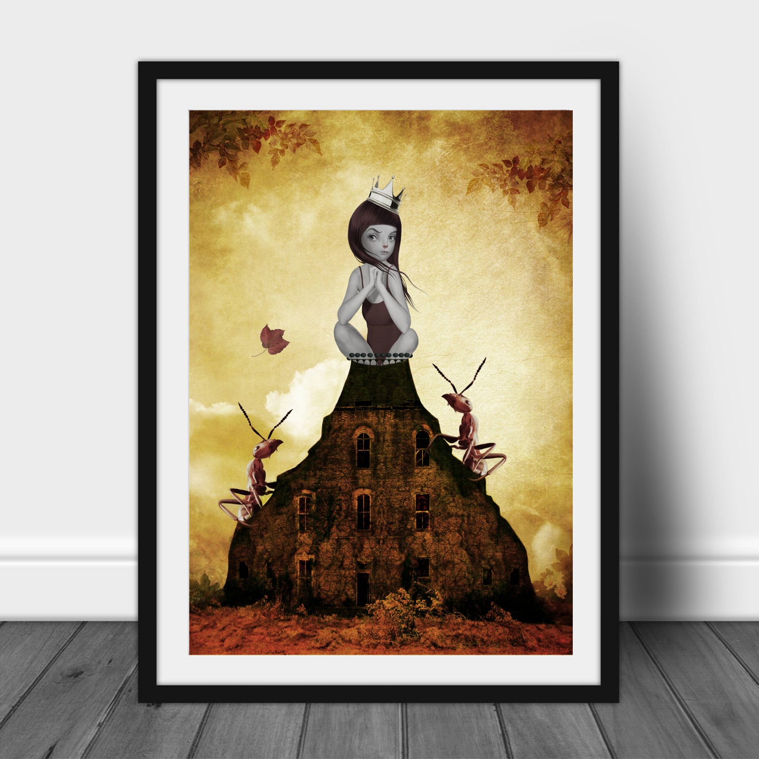 Art print of a girl and red ants, in a frame, leaned against a wall.