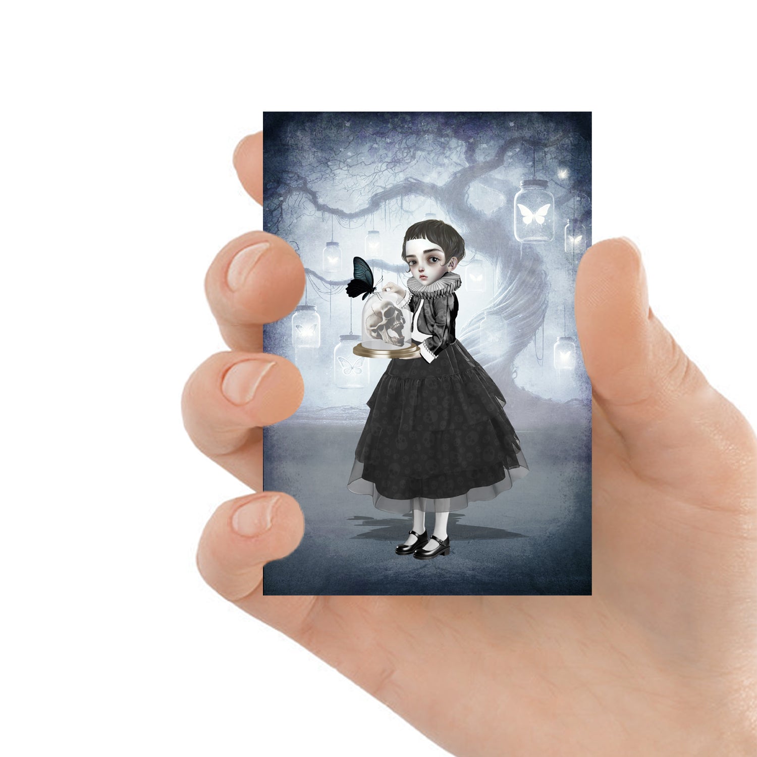 The Girl and Skull ACEO card featuring Memento Mori art, held in hand to showcase its compact size and intricate details, perfect for collectors.