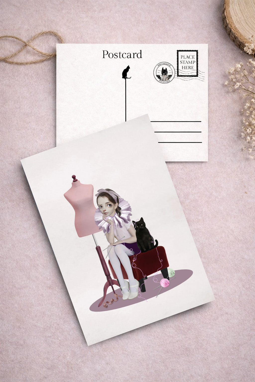 cat themed postcard, illustration of a girl and a black cat on a chair, surrounded by wool.