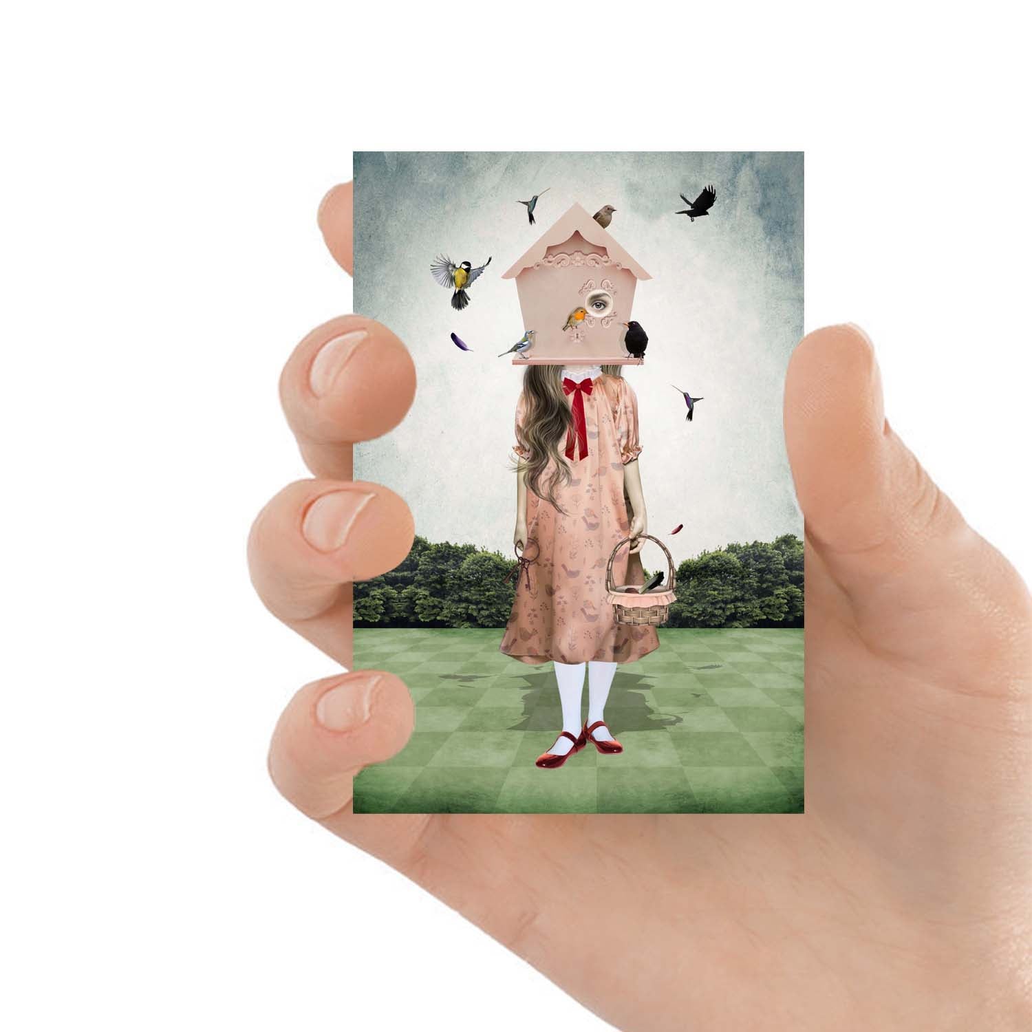 ACEO art card featuring a girl with garden birds, held in hand to showcase the miniature size and quirky design.